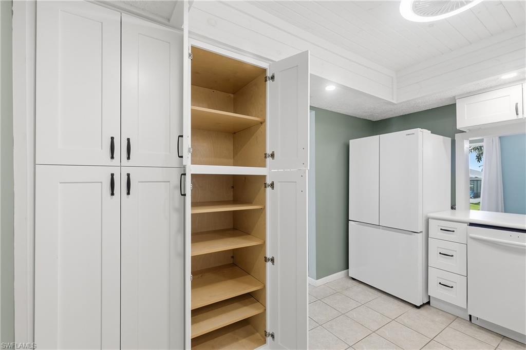 Stand-alone pantry provides lots of storage in the updated kitchen.