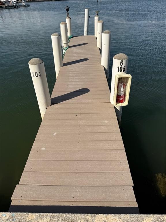 Waterfront dock with composite decking and multiple pilings