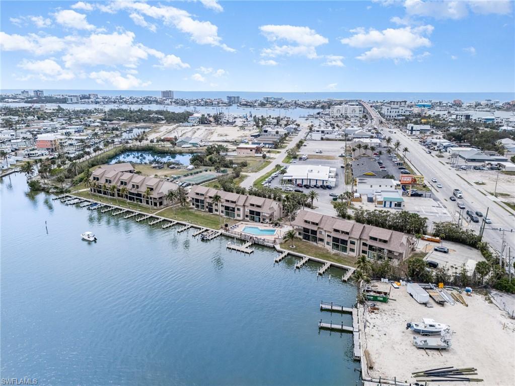 Birds eye view of property featuring a water view