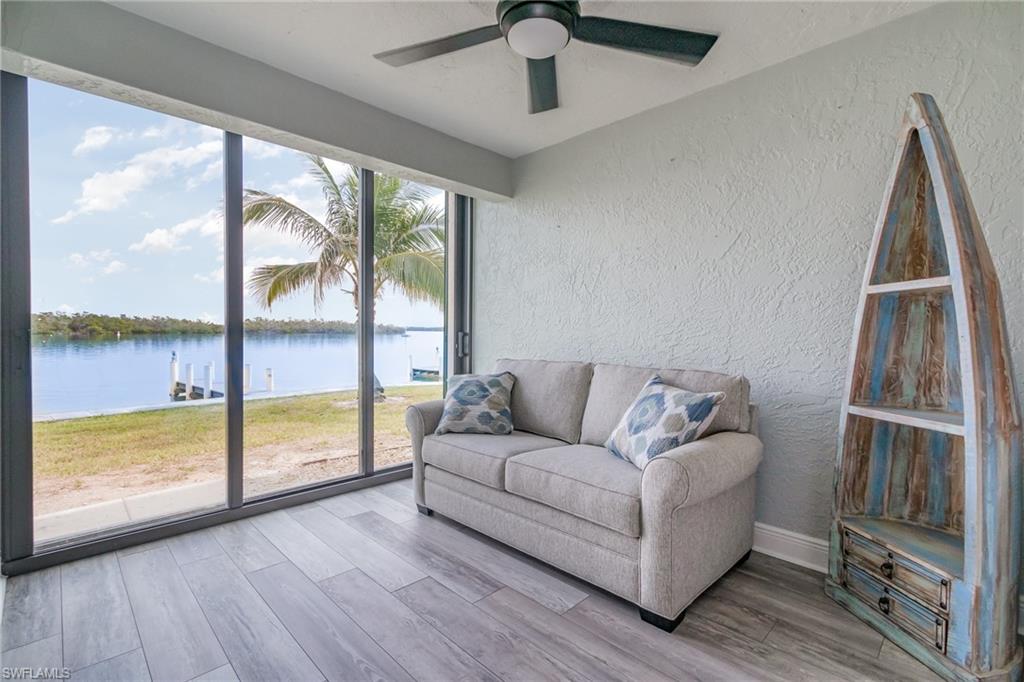 Sunroom with a water view