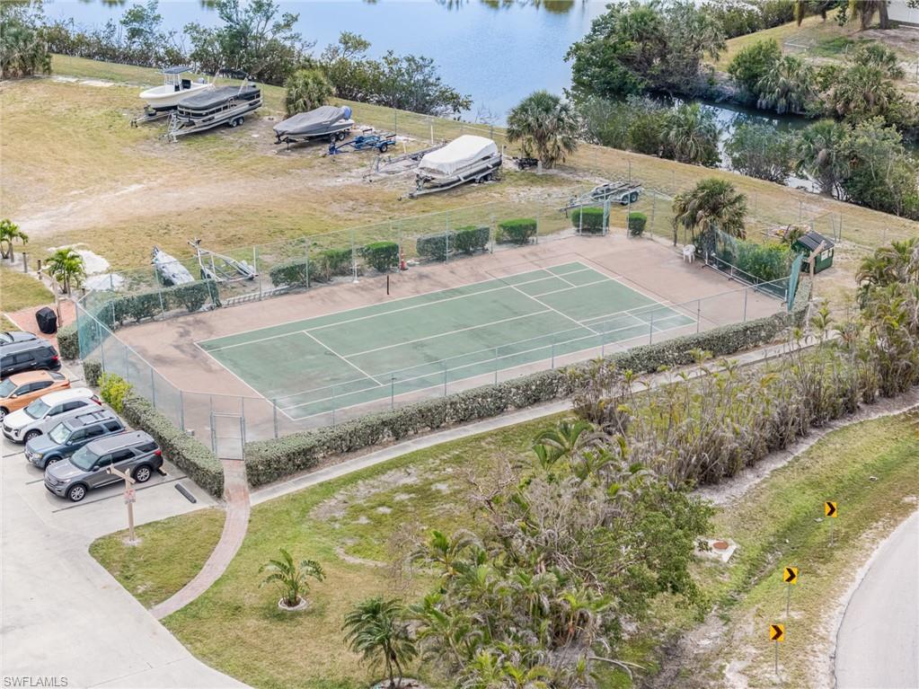 Birds eye view of property with a water view