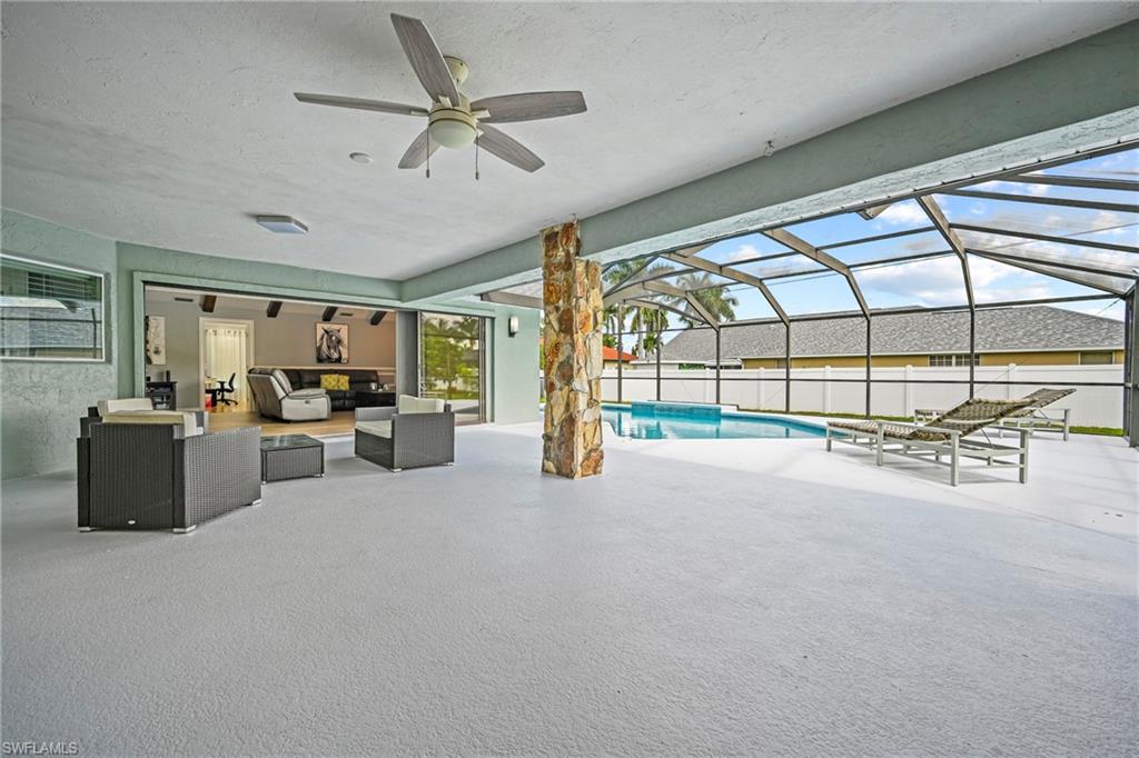 Spacious covered patio with ceiling fan and stone-clad column
