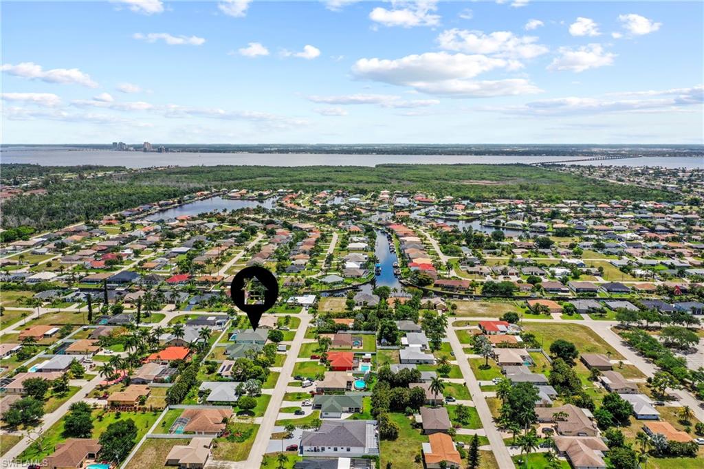 Aerial perspective showcasing a residential neighborhood with numerous canals