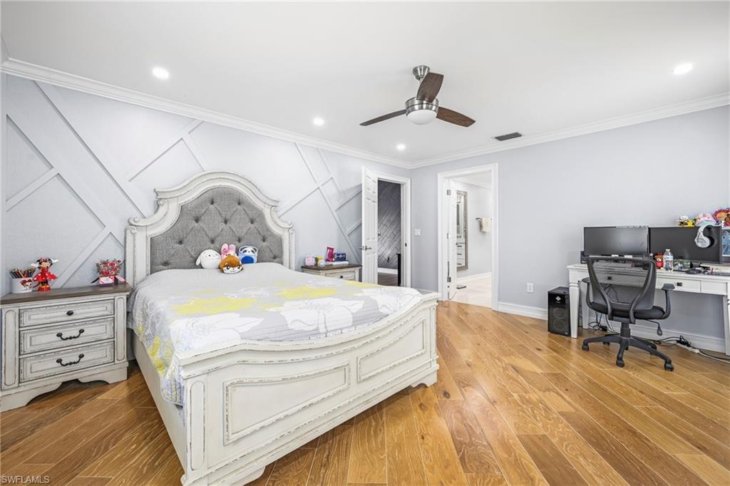 Bedroom featuring wood-finish flooring, recessed lighting, and a ceiling fan