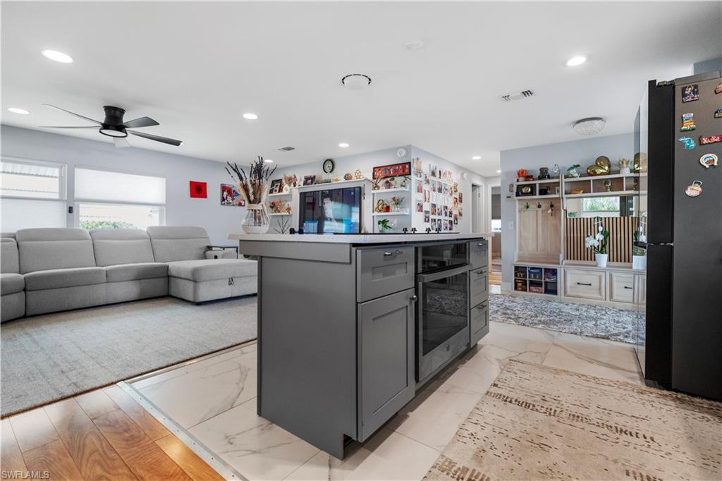 Central kitchen island with integrated oven