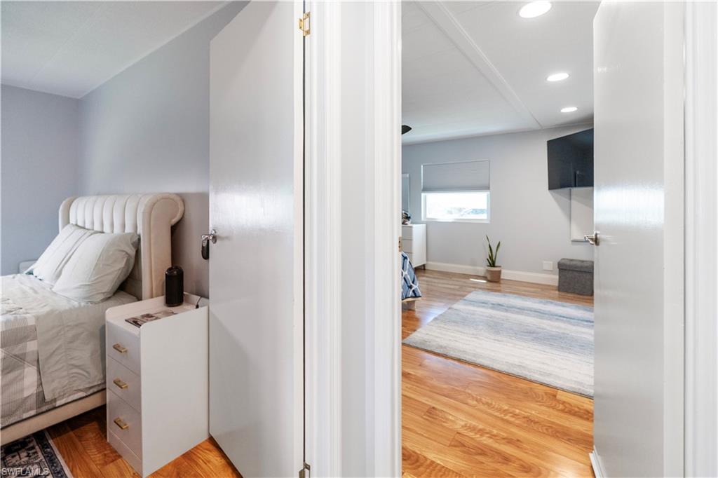 Interior room featuring wood-finish flooring, recessed lighting, and light gray wall paint