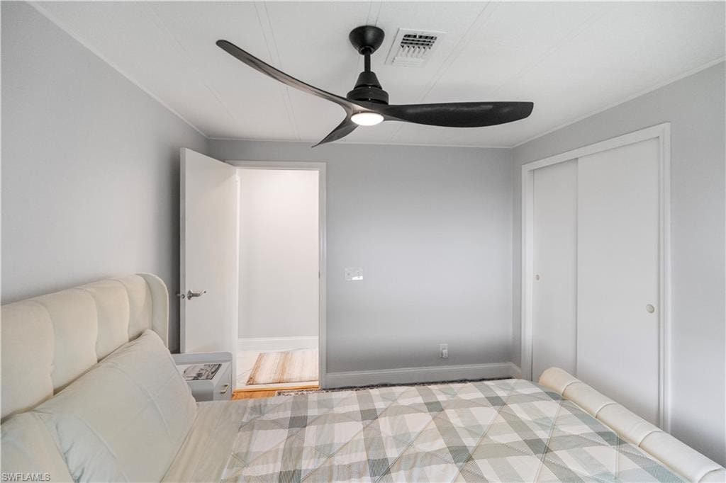 Recessed lighting and ceiling fan overhead provide illumination