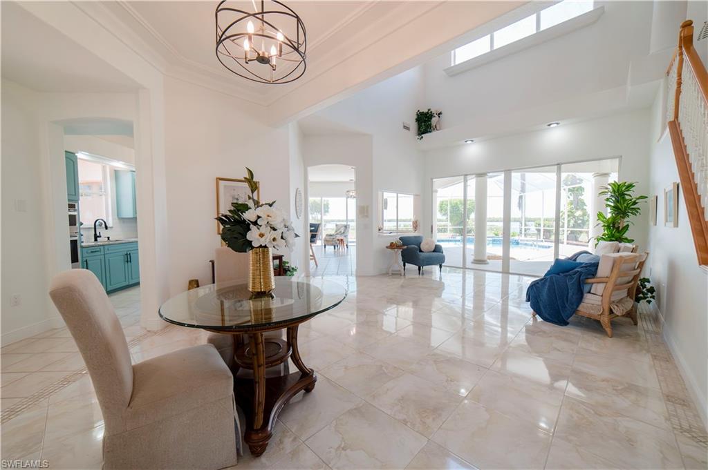 Wall of glass through living room and family overlooking bay