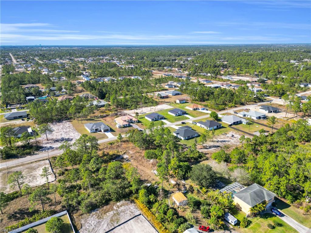 Aerial view of property's location featuring nearby suburban area