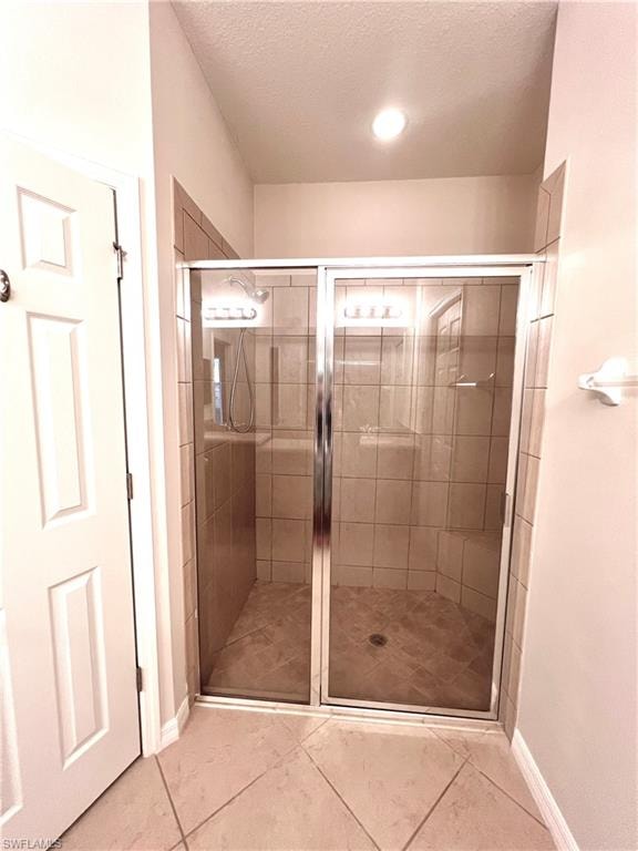 Bathroom Features Tiled Walk In Shower With Built In Bench and Private Water Closet