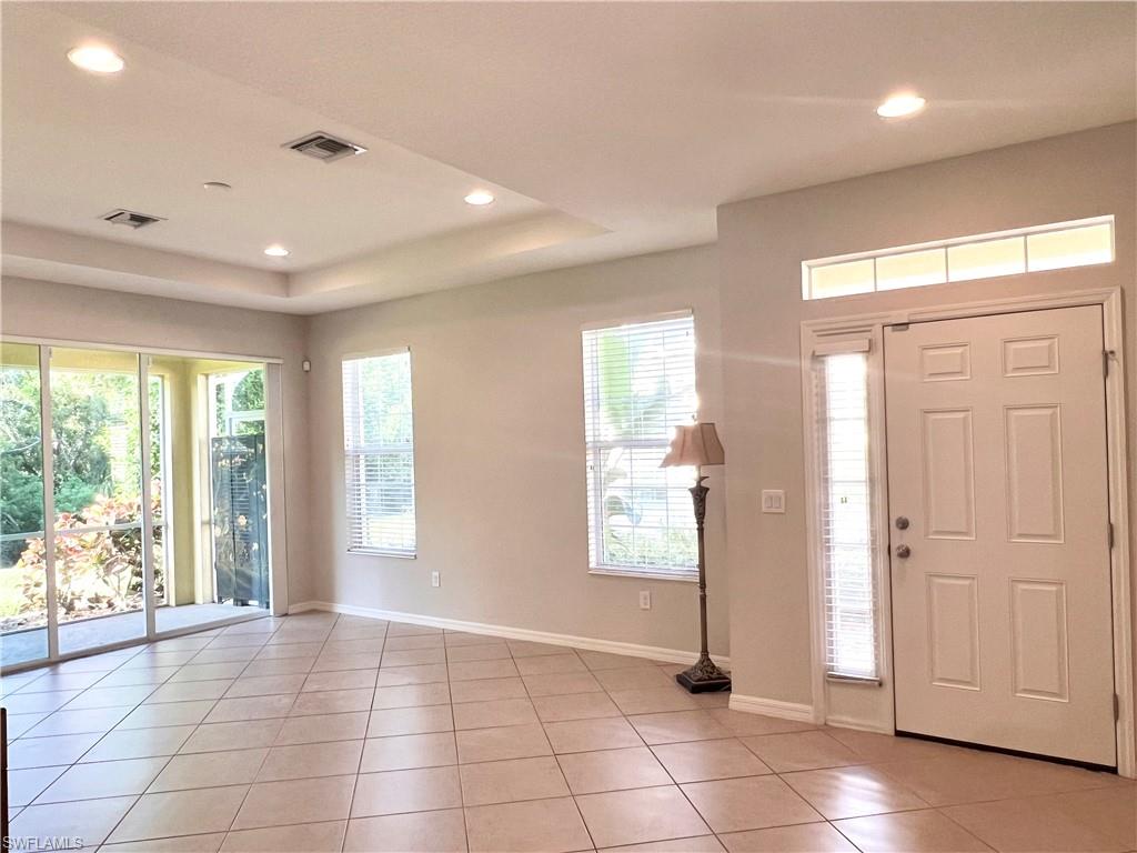 Entrance & Great Room are so light & bright thanks to the many large windows & double slider to the lanai
