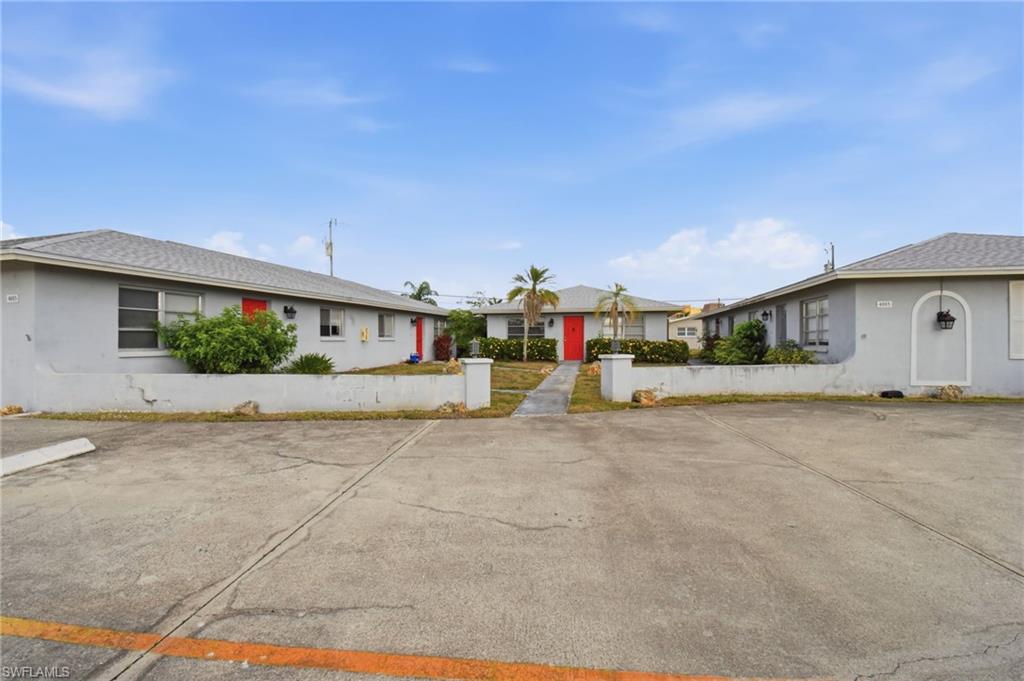 Multi-unit property with a central paved parking area
