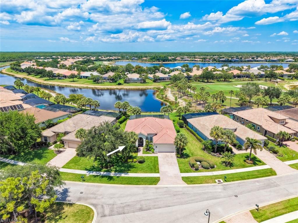 Aerial view of the home and Twin Eagles Golf Course