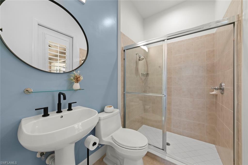 Guest bathroom with new hardware and Kohler toilets.