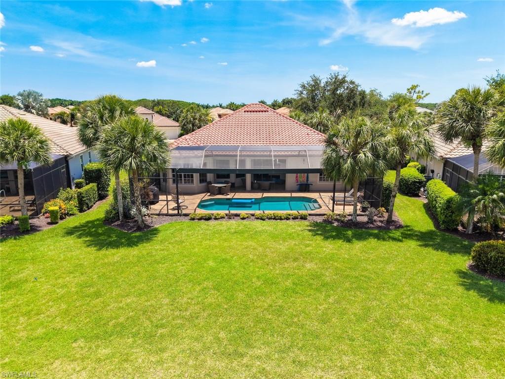 Rear view of the backyards, house and pool.