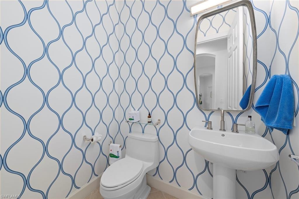 Half bathroom with new hardware and Kohler toilets.