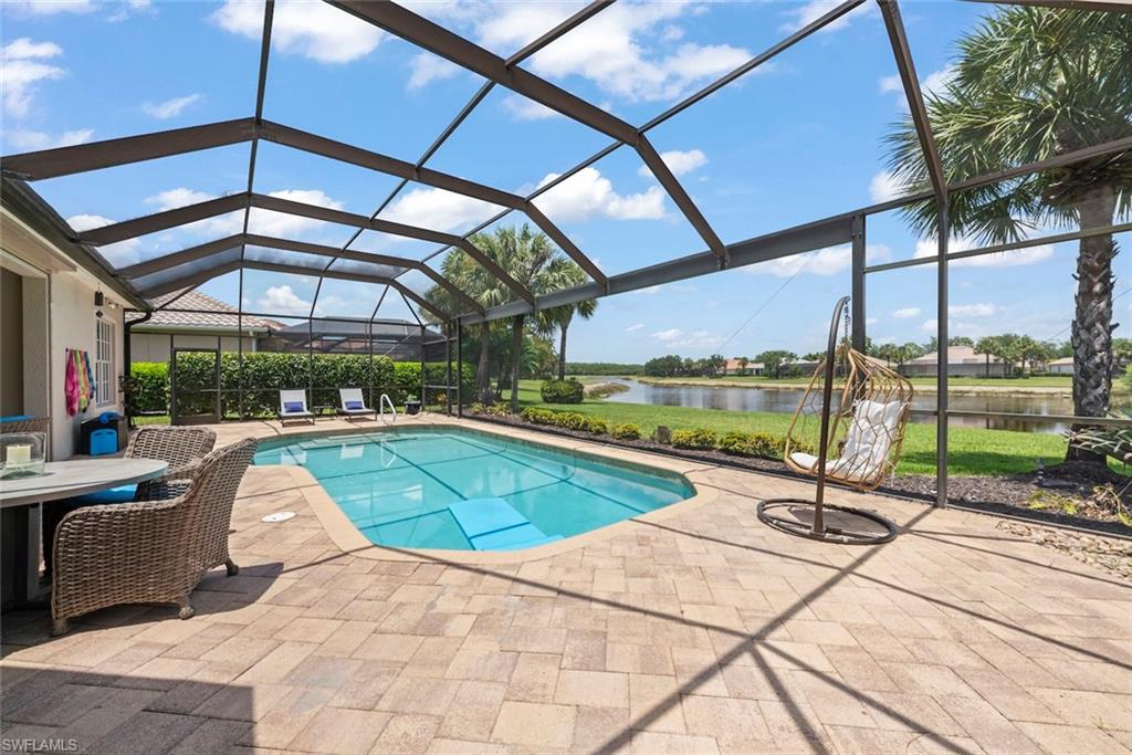 Pool on extended lanai with large picture screen.