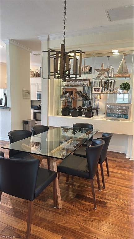 Dining space with wood finished floors