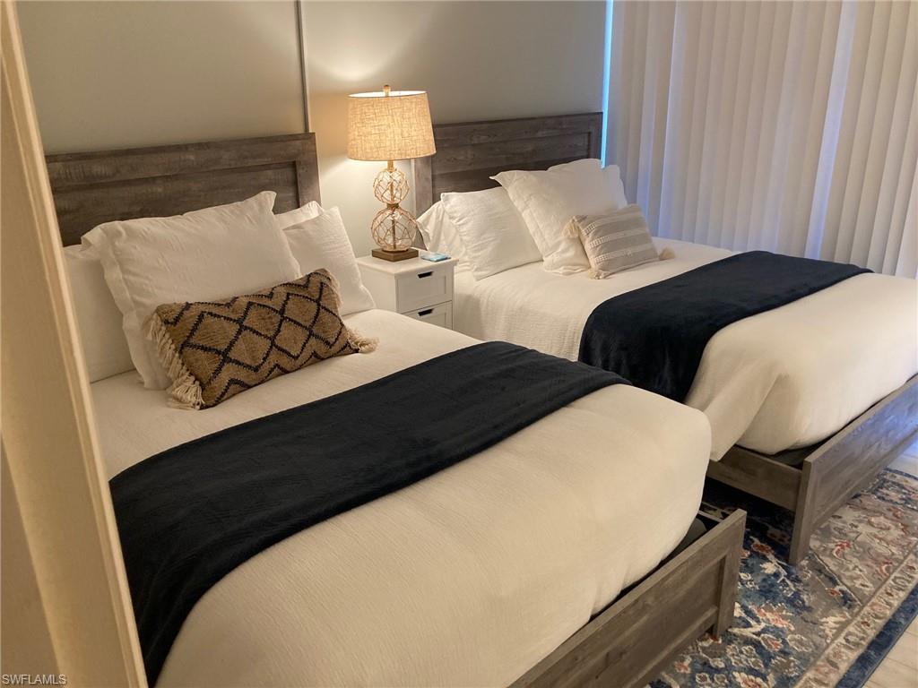 2 double beds in guest bedroom