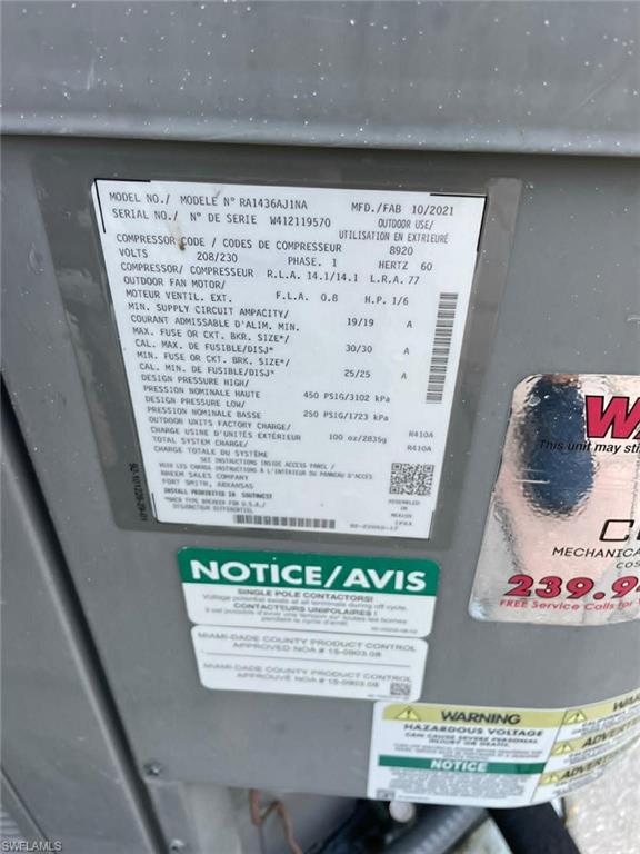 Exterior A/C unit with manufacturer's label — modern equipment supporting efficient climate control