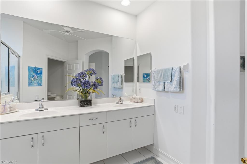 Dual vanity with integrated sinks and chrome fixtures