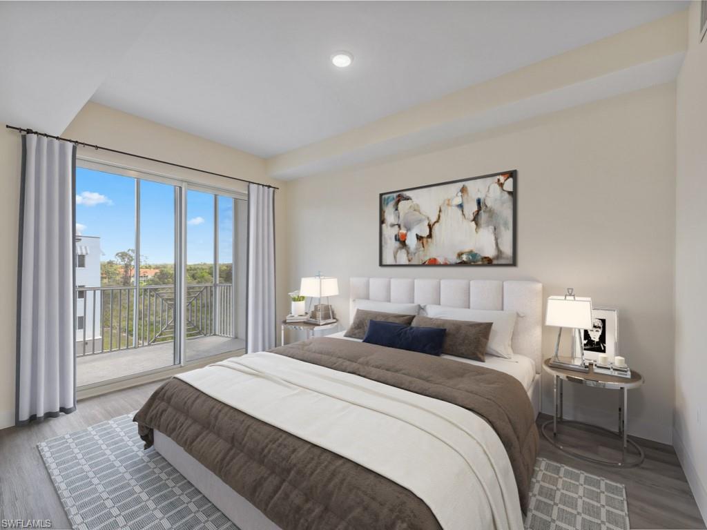Virtually staged photo. Bedroom with large sliding glass doors opening to a private balcony