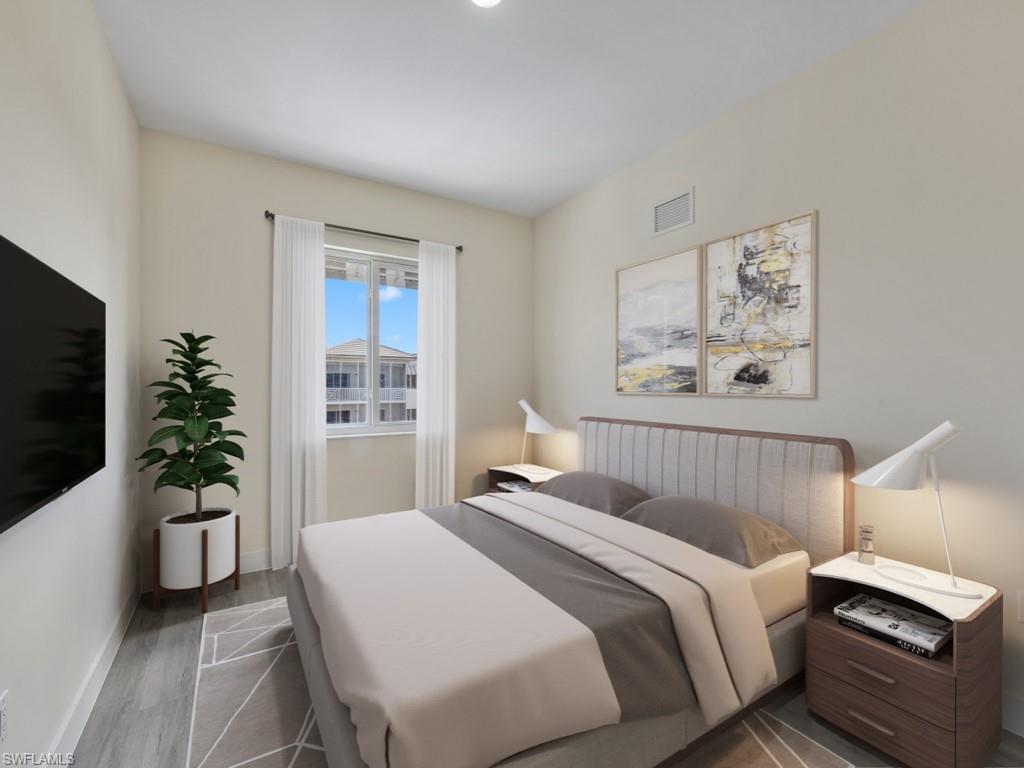 Virtually staged photo. Bedroom featuring vinyl flooring.