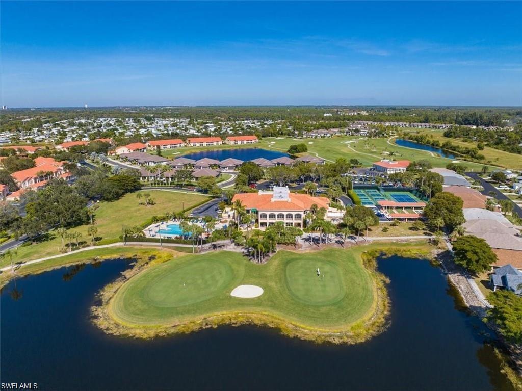 Expansive golf course and water features with surrounding residential properties