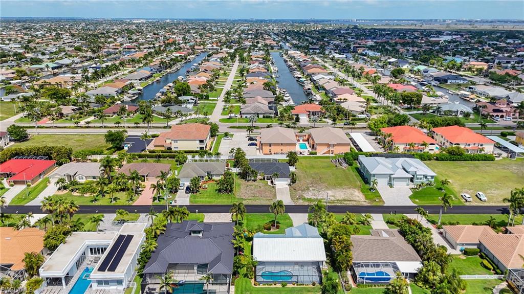 Expansive aerial perspective showcasing a residential area with a prominent canal system
