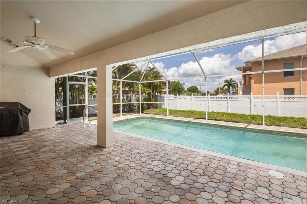 Screened-in patio with geometric paver flooring