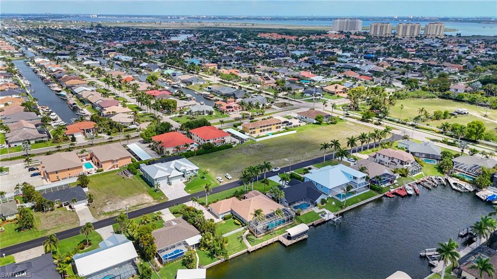 Aerial perspective showcasing a residential area with extensive canal access