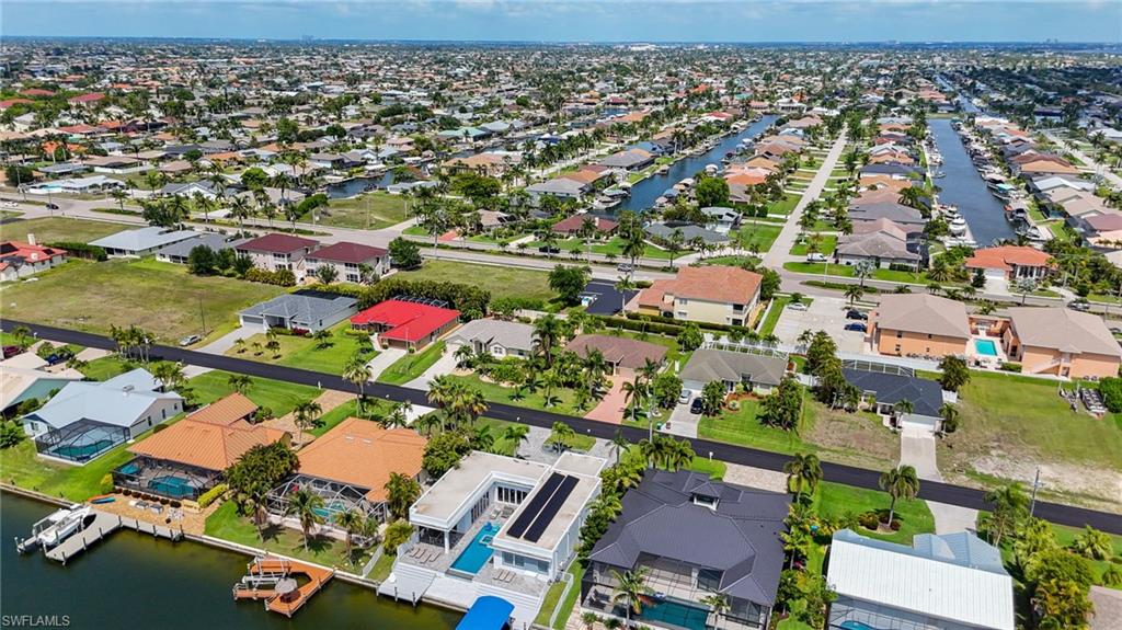 Expansive aerial perspective showcasing a residential area with canal access