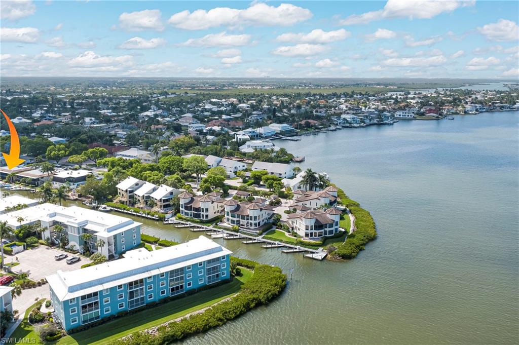 Waterfront community featuring multiple residential buildings with private boat slips