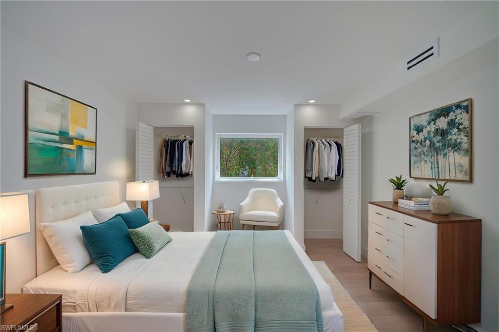 Recessed lighting and light wood-finish flooring complement the neutral wall tones