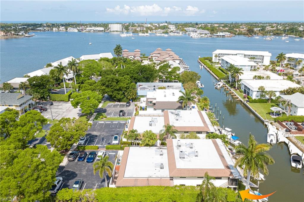 Aerial perspective showcasing waterfront properties with private boat docks
