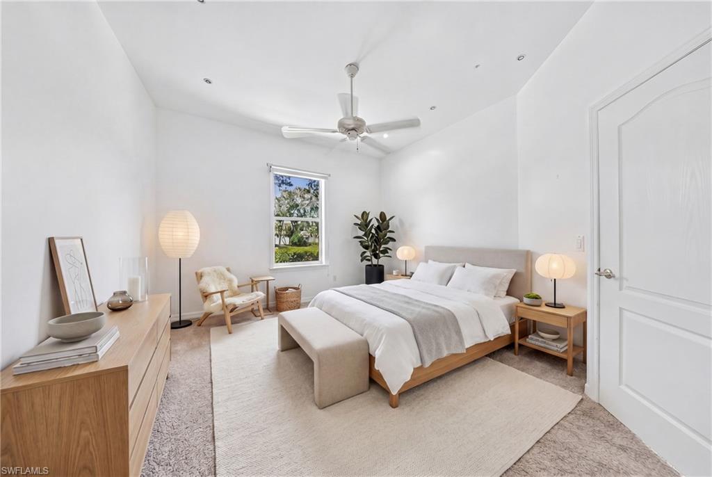 Bright bedroom featuring a single window, recessed lighting, a ceiling fan, and carpeted flooring
