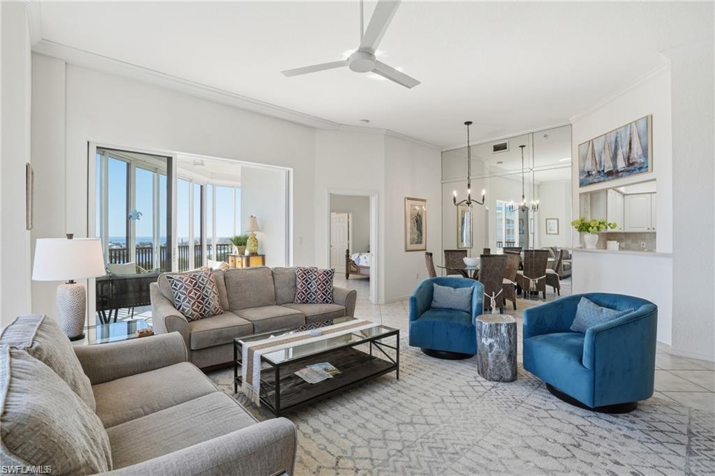 Open-concept living space featuring a spacious living area, dining area, and kitchen pass-through