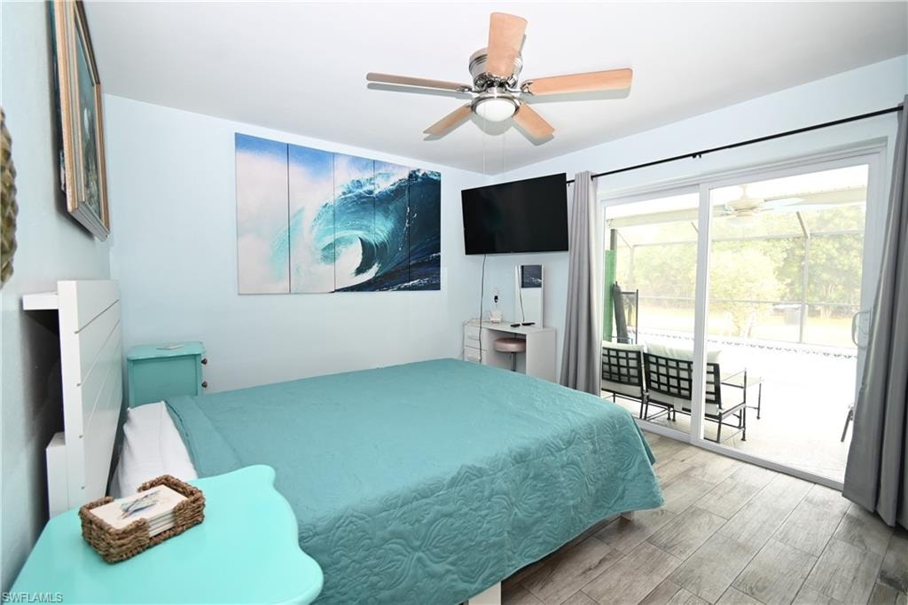 Wood-finish flooring throughout, featuring a ceiling fan with light fixture
