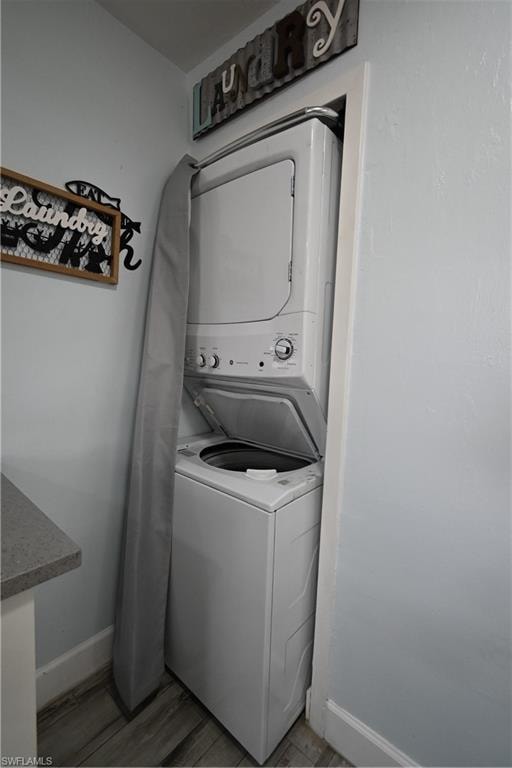 Stacked laundry appliances featuring a top-loading washer and front-loading dryer, integrated into a dedicated alcove