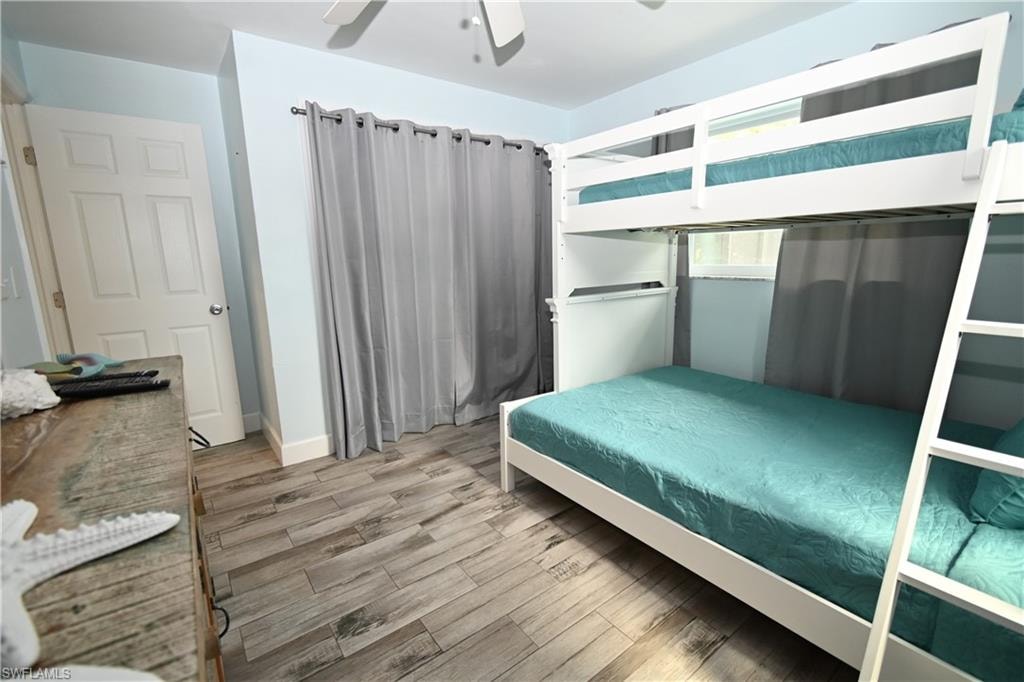 Light blue wall paint complements the wood-finish flooring