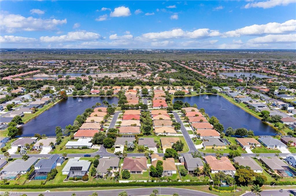Aerial view of a residential community featuring multiple interconnected bodies of water