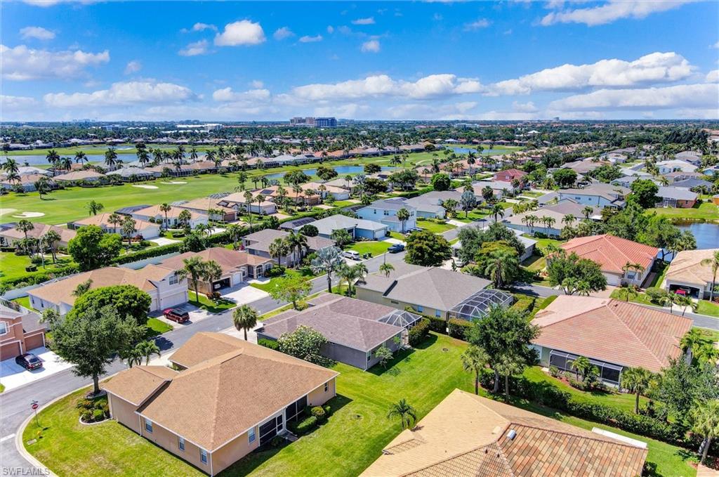 Expansive residential neighborhood featuring single-story homes, mature landscaping, and golf course frontage