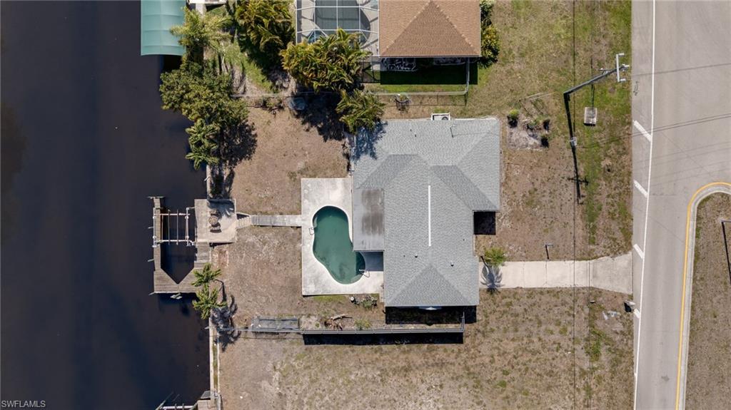 Property featuring a waterside location with a private dock