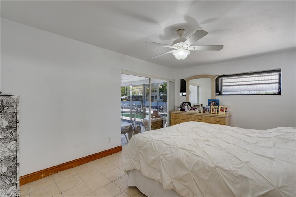 Room featuring tile flooring and a ceiling fan with integrated lighting