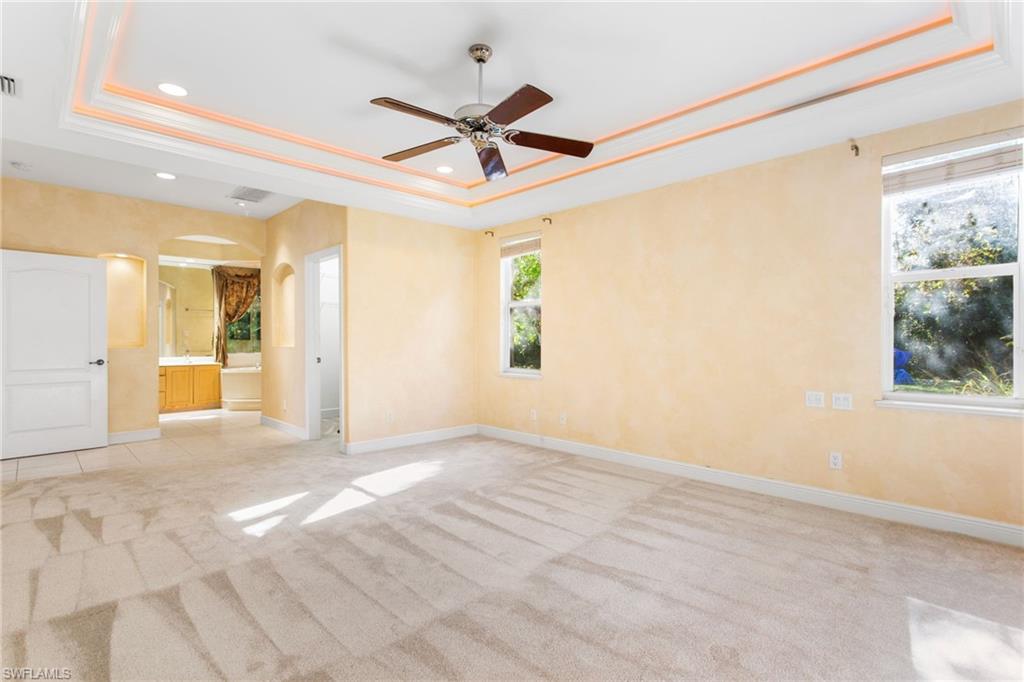 Tray ceiling with recessed lighting and a ceiling fan