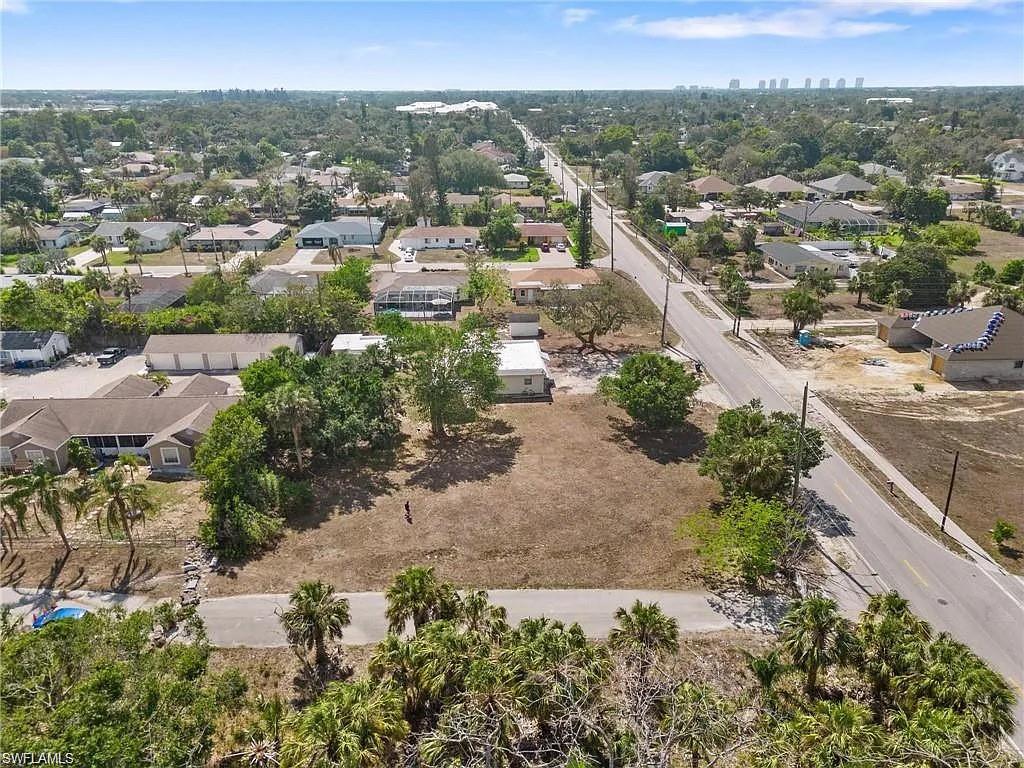 Expansive cleared land parcel with direct paved road frontage