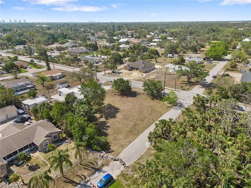 Expansive land parcel featuring existing street access and mature tree coverage