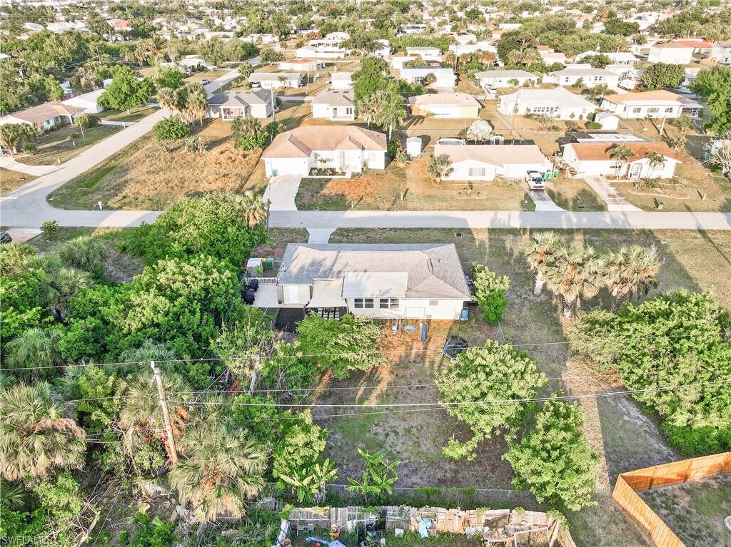 Expansive property with substantial green space, mature trees, and privacy landscaping