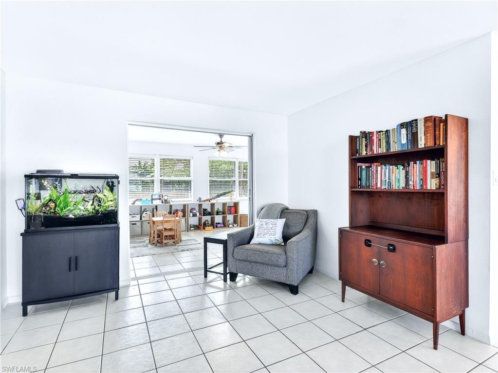 Bright interior space featuring light tile flooring and white walls