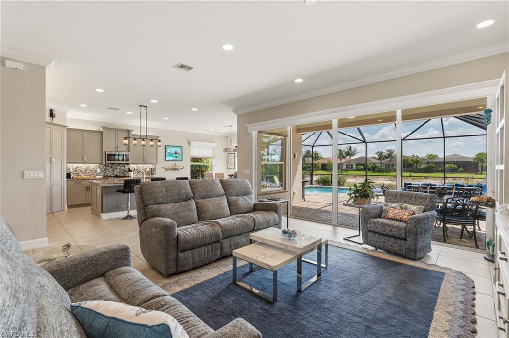 Large open great room with view of pool and lake.